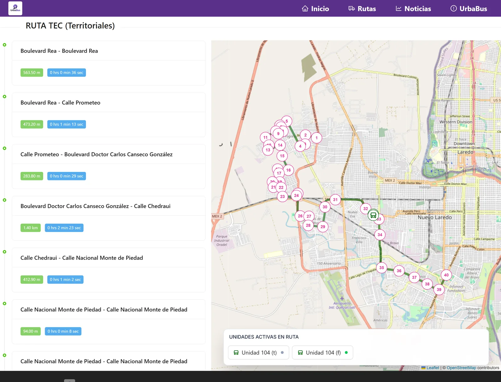 Página pública de la Ruta TEC de Urbabus: el trazo de la ruta sobre el mapa de Nuevo Laredo con sus paradas numeradas, el desglose de tramos con distancia y tiempo, y el panel de unidades activas.